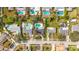 Real estate showcasing beautiful properties with sparkling pools, lush landscaping and an aerial view of the neighborhood at 3124 61St N Ln, St Petersburg, FL 33710
