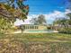 This large backyard features a pool, lush landscaping, and plenty of space to roam at 3124 61St N Ln, St Petersburg, FL 33710