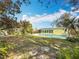This sprawling backyard has a large grassy area, a swimming pool, and a shed at 3124 61St N Ln, St Petersburg, FL 33710
