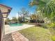 Fenced backyard featuring a private pool and lush tropical landscaping at 3124 61St N Ln, St Petersburg, FL 33710