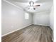 Spacious bedroom with natural light, ceiling fan, and hard surface floors at 3124 61St N Ln, St Petersburg, FL 33710