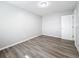 Bedroom featuring a door, hard surface floors, and natural light at 3124 61St N Ln, St Petersburg, FL 33710