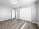 Bedroom featuring closet, door, and hard surface floors at 3124 61St N Ln, St Petersburg, FL 33710