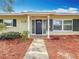 Inviting home entrance, with a covered porch and a manicured landscape at 3124 61St N Ln, St Petersburg, FL 33710