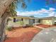 Charming single-story home with a well-manicured front yard and mature landscaping at 3124 61St N Ln, St Petersburg, FL 33710