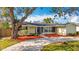 Charming single-story home with a well-manicured front yard and mature landscaping at 3124 61St N Ln, St Petersburg, FL 33710