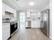 Updated kitchen featuring stainless steel appliances and white cabinets at 3124 61St N Ln, St Petersburg, FL 33710