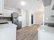 Bright kitchen features white cabinets, stainless steel appliances, and stone countertops at 3124 61St N Ln, St Petersburg, FL 33710