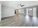 Spacious living room features wood floors, a ceiling fan, and plenty of natural light at 3124 61St N Ln, St Petersburg, FL 33710