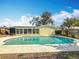 Enjoy this pristine pool with an enclosed, window-lined lanai connected to the house at 3124 61St N Ln, St Petersburg, FL 33710