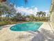 Enjoy this backyard pool surrounded by lush, tropical landscaping, and a bonus shed at 3124 61St N Ln, St Petersburg, FL 33710