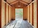 Spacious shed interior with exposed framing and ample natural light, ready for customization and organization at 3124 61St N Ln, St Petersburg, FL 33710