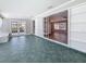 View of the sunroom with tile floors transitioning to living room with hardwood floors at 3124 61St N Ln, St Petersburg, FL 33710