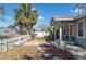 Charming single-story home with a manicured lawn, a white picket fence, and a welcoming front porch at 313 27Th N St, St Petersburg, FL 33713