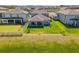 Aerial view of a home featuring a fenced backyard and patio seating at 3133 King Fern Dr, Wimauma, FL 33598