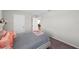 Neutral bedroom with a full bed, two closets, and a door leading to the game room at 3133 King Fern Dr, Wimauma, FL 33598