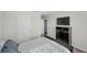 Cozy bedroom featuring a queen bed, large dresser with TV, and neutral tones at 3133 King Fern Dr, Wimauma, FL 33598