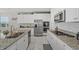 Modern kitchen with granite countertops, stainless steel appliances, and white cabinetry at 3133 King Fern Dr, Wimauma, FL 33598