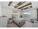 Comfortable main bedroom with a decorative tray ceiling, plush carpeting, and a scenic water view at 3133 King Fern Dr, Wimauma, FL 33598