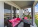 Inviting covered patio with cozy seating area and outdoor fireplace, perfect for relaxation at 3133 King Fern Dr, Wimauma, FL 33598