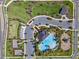 Aerial shot of a community pool with a playground, ample parking, and beautiful landscaping at 3133 King Fern Dr, Wimauma, FL 33598