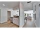 Bright kitchen featuring white cabinetry, granite countertops, and stainless steel appliances at 3308 W Santiago St # B, Tampa, FL 33629