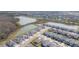Community aerial shot reveals serene lakes, lush greenery, and peaceful neighborhood streets at 33277 Rosewood Bark Way, Wesley Chapel, FL 33545