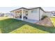 Well-maintained backyard and covered patio, ideal for outdoor living and entertainment at 33277 Rosewood Bark Way, Wesley Chapel, FL 33545