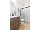 Stylish bathroom showcasing a modern vanity, walk-in shower with glass doors, and neutral tones for a clean aesthetic at 33277 Rosewood Bark Way, Wesley Chapel, FL 33545