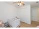 Bedroom features a crib, neutral floors, and white closet at 33277 Rosewood Bark Way, Wesley Chapel, FL 33545