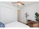 Comfortable bedroom with ample closet space, recessed lighting, and an accent chair for a relaxing retreat at 33277 Rosewood Bark Way, Wesley Chapel, FL 33545