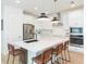 Modern kitchen with stainless steel appliances, granite countertops, and a center island with bar seating at 33277 Rosewood Bark Way, Wesley Chapel, FL 33545