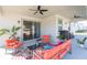 Inviting covered patio features stylish seating, ceiling fans, and a seamless indoor-outdoor flow at 33277 Rosewood Bark Way, Wesley Chapel, FL 33545