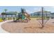 Community playground with slides and climbing structures provides outdoor fun for residents at 33277 Rosewood Bark Way, Wesley Chapel, FL 33545