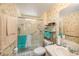 Bathroom featuring a glass shower with a handrail and a white vanity at 35020 Colony Hills Dr, Zephyrhills, FL 33541