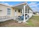 Back patio with table, chairs, and grill at 35020 Colony Hills Dr, Zephyrhills, FL 33541