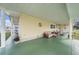 View of the covered porch with outdoor seating at 35020 Colony Hills Dr, Zephyrhills, FL 33541