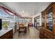 Bright sunroom featuring a dining table, wood floors, lots of natural light, and a comfortable seating area at 35020 Colony Hills Dr, Zephyrhills, FL 33541