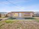 Exterior view of home with a large backyard featuring a well maintained fence, grass, and building details at 4037 Chesswood Dr, Holiday, FL 34691