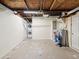 Unfinished basement showcasing laundry area, water heater, and ample space for customization at 4037 Chesswood Dr, Holiday, FL 34691