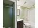 Well-lit bathroom featuring tiled shower, white toilet, and dark vanity at 4037 Chesswood Dr, Holiday, FL 34691