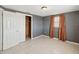 Bedroom featuring a spacious closet, a window and tile flooring at 4037 Chesswood Dr, Holiday, FL 34691