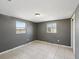 Bedroom with tile flooring and natural light at 4037 Chesswood Dr, Holiday, FL 34691