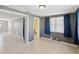 Bedroom with tile floors and a view into the bathroom at 4037 Chesswood Dr, Holiday, FL 34691