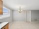 Bright dining area with tile floors, neutral walls, and a view of the kitchen area at 4037 Chesswood Dr, Holiday, FL 34691