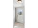 Bright entryway with a front door with glass panes and neutral-colored tile flooring at 4037 Chesswood Dr, Holiday, FL 34691