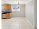 Cozy kitchen area with tile flooring, oak cabinets, and black countertops at 4037 Chesswood Dr, Holiday, FL 34691
