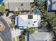 Aerial view of neighborhood showing home with tile roof, pool, and mature landscaping at 404 Westborough Ln, Safety Harbor, FL 34695