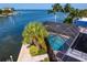 Aerial view of the screened-in pool overlooking the canal at 4464 46Th S Ave, St Petersburg, FL 33711