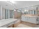 Spacious bathroom with dual sinks, ample counter space, and tub in a classic design at 4464 46Th S Ave, St Petersburg, FL 33711